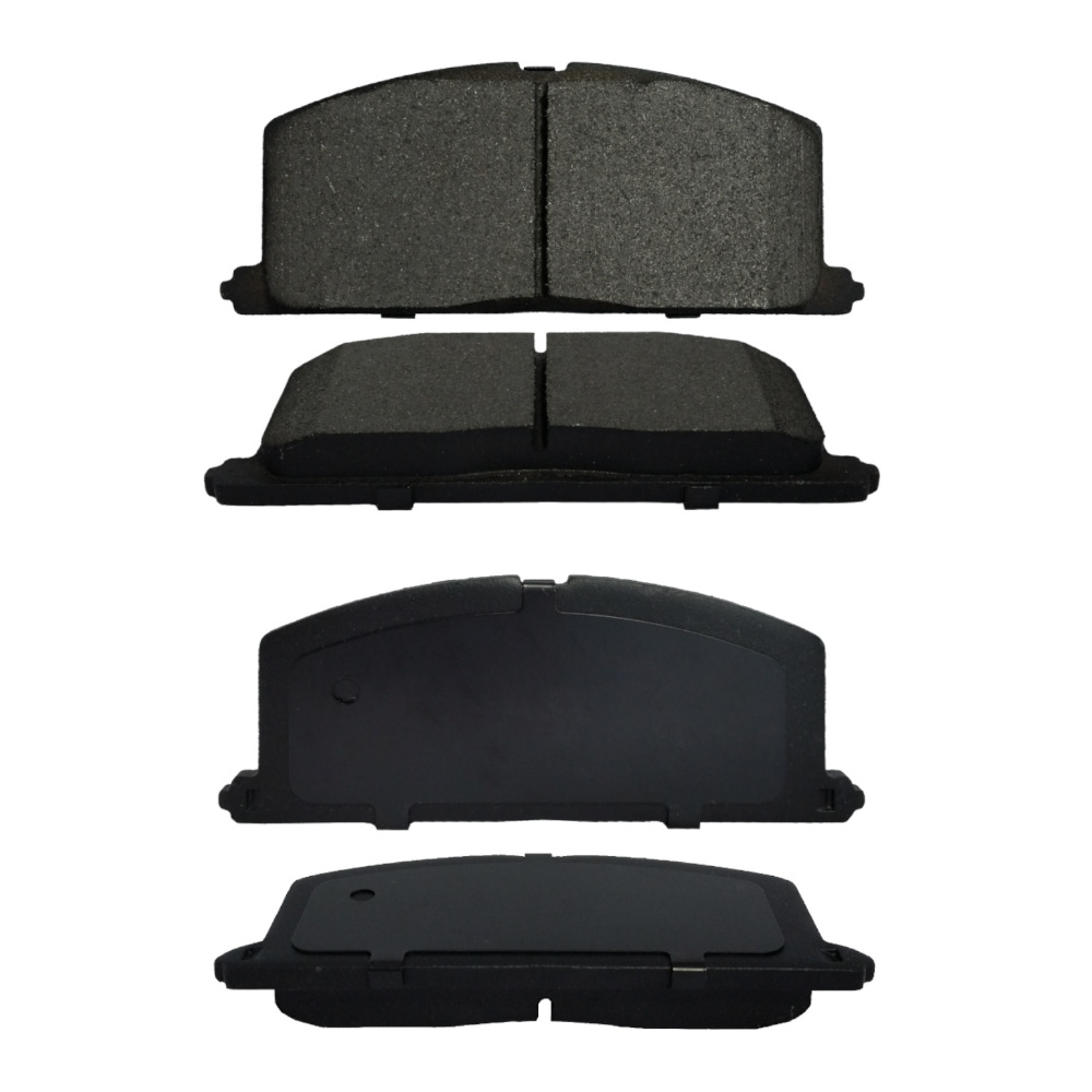 A picture of four automotive brake pads